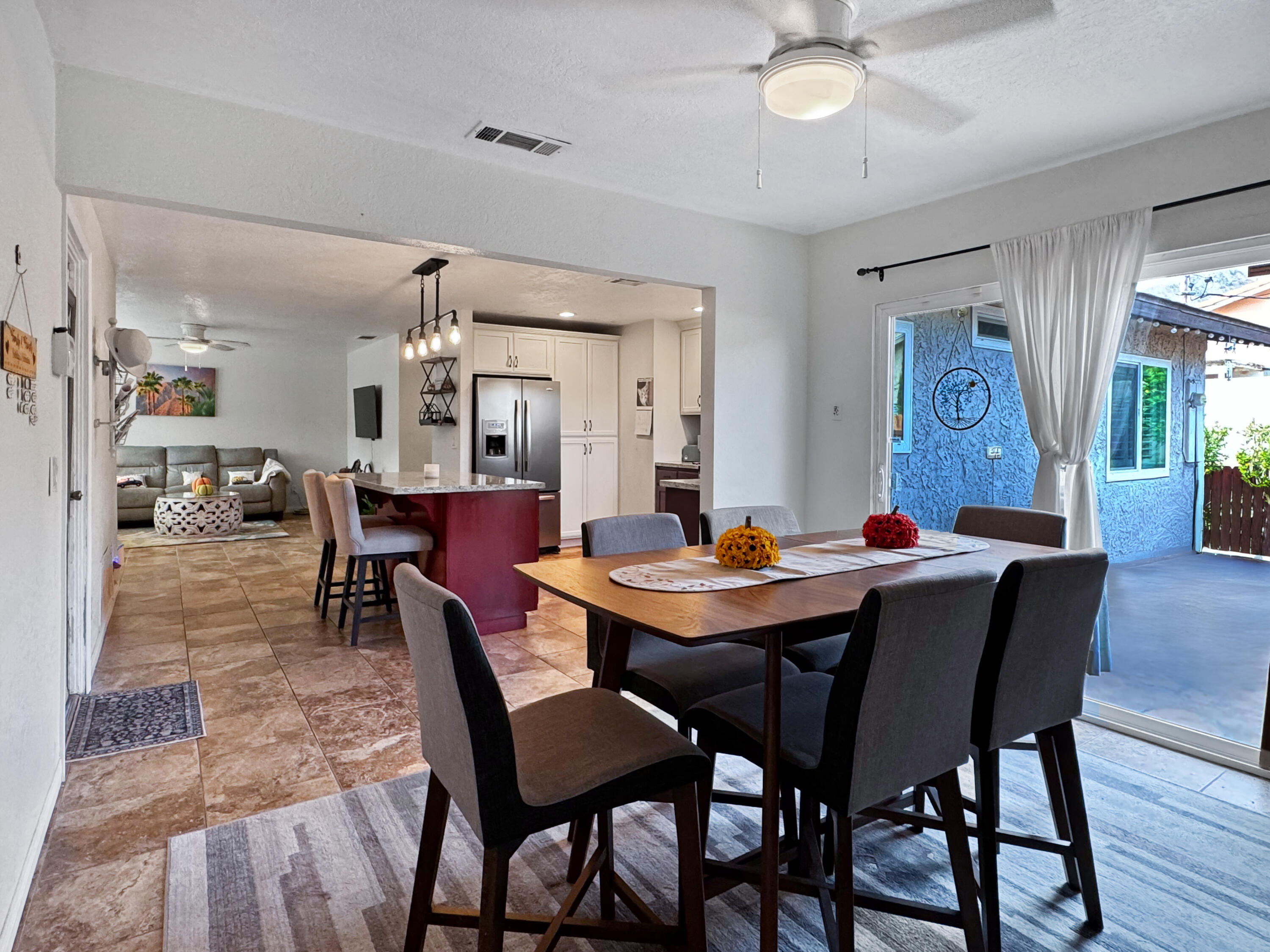 53845 Avenida Herrera La Quinta, CA 92253 - Photo 15 of 25 a view of a dining room with furniture and wooden floor