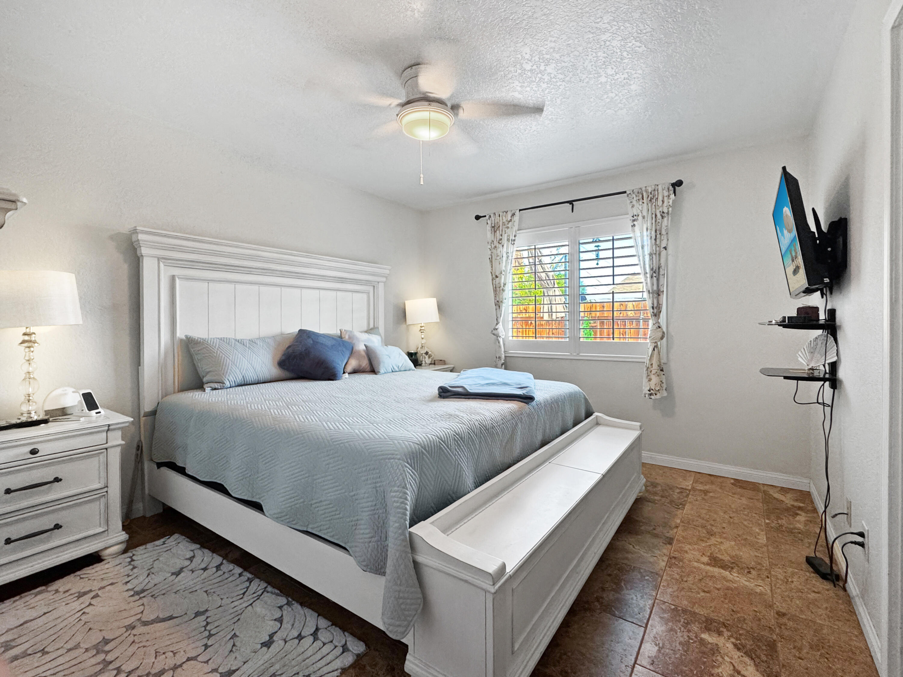 53845 Avenida Herrera La Quinta, CA 92253 - Photo 17 of 25 a bedroom with a bed and a chandelier