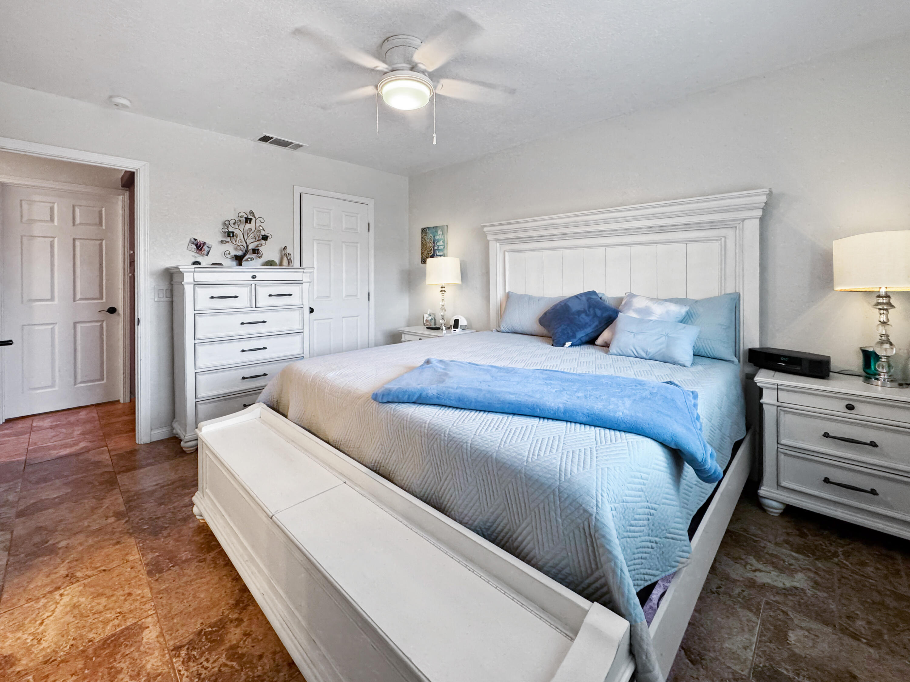 53845 Avenida Herrera La Quinta, CA 92253 - Photo 18 of 25 a bedroom with a bed and a chandelier