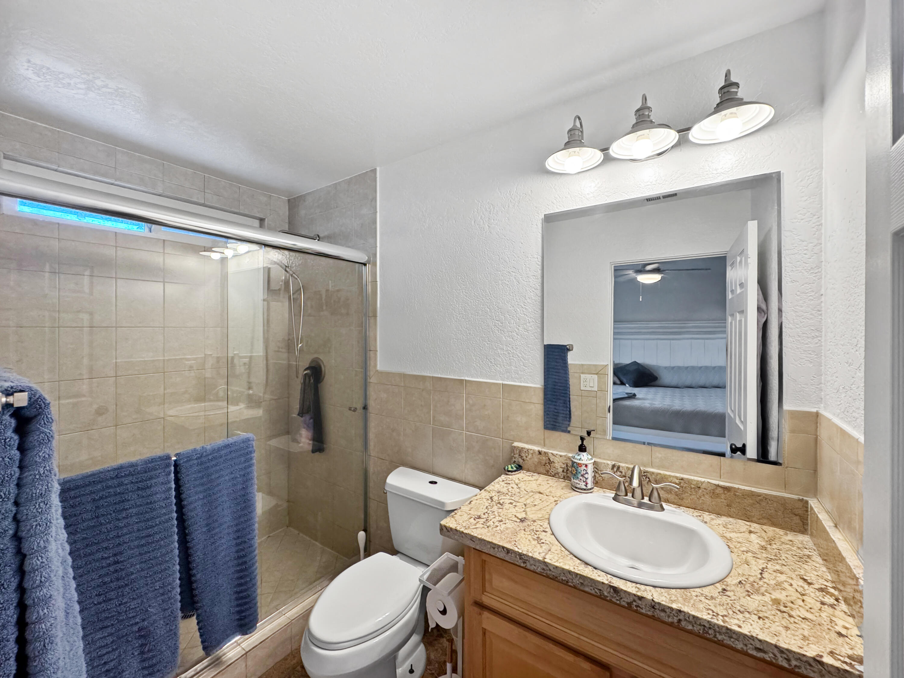 53845 Avenida Herrera La Quinta, CA 92253 - Photo 19 of 25 a bathroom with a sink a toilet and shower