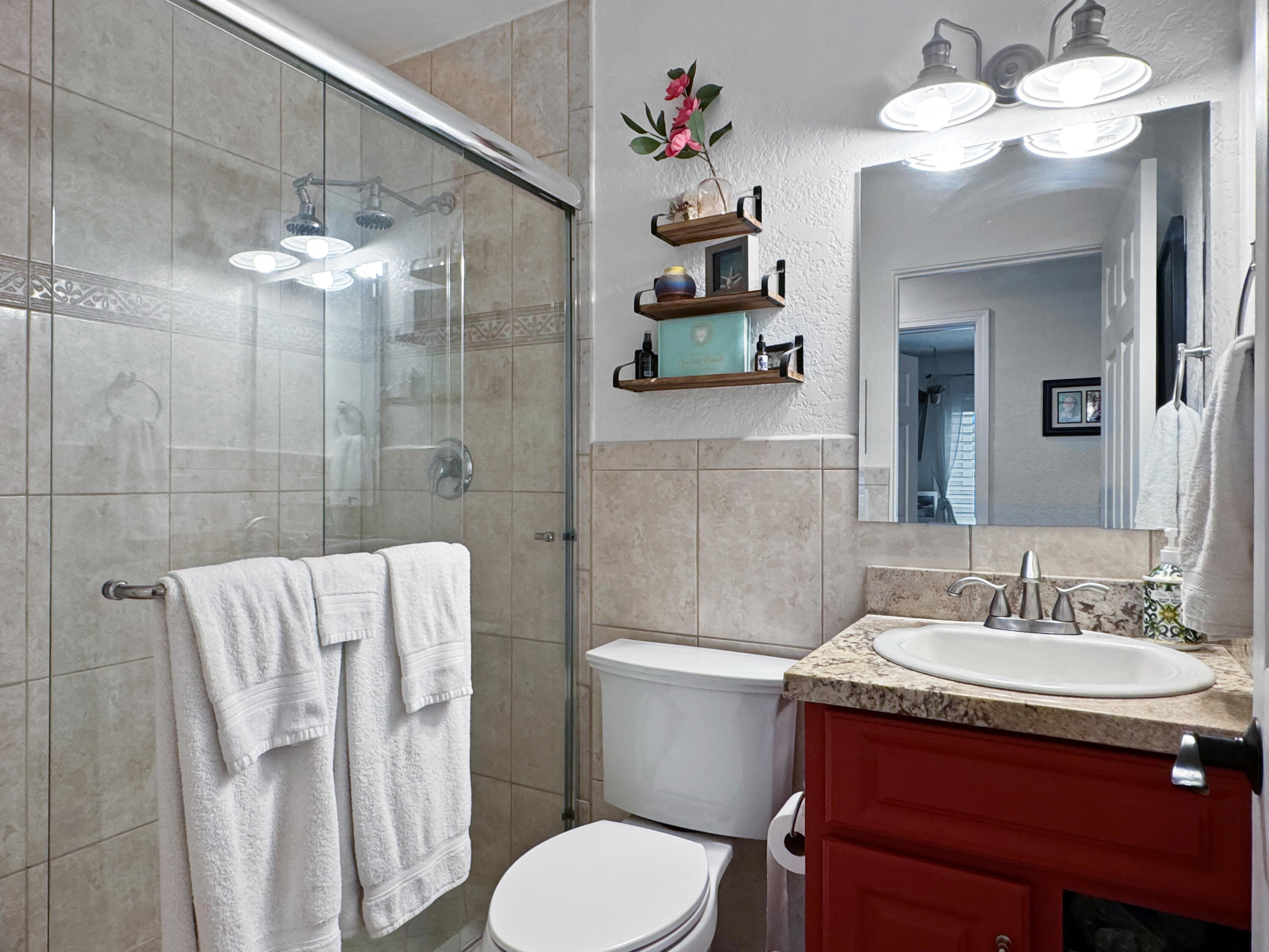53845 Avenida Herrera La Quinta, CA 92253 - Photo 21 of 25 a bathroom with a sink vanity mirror and toilet