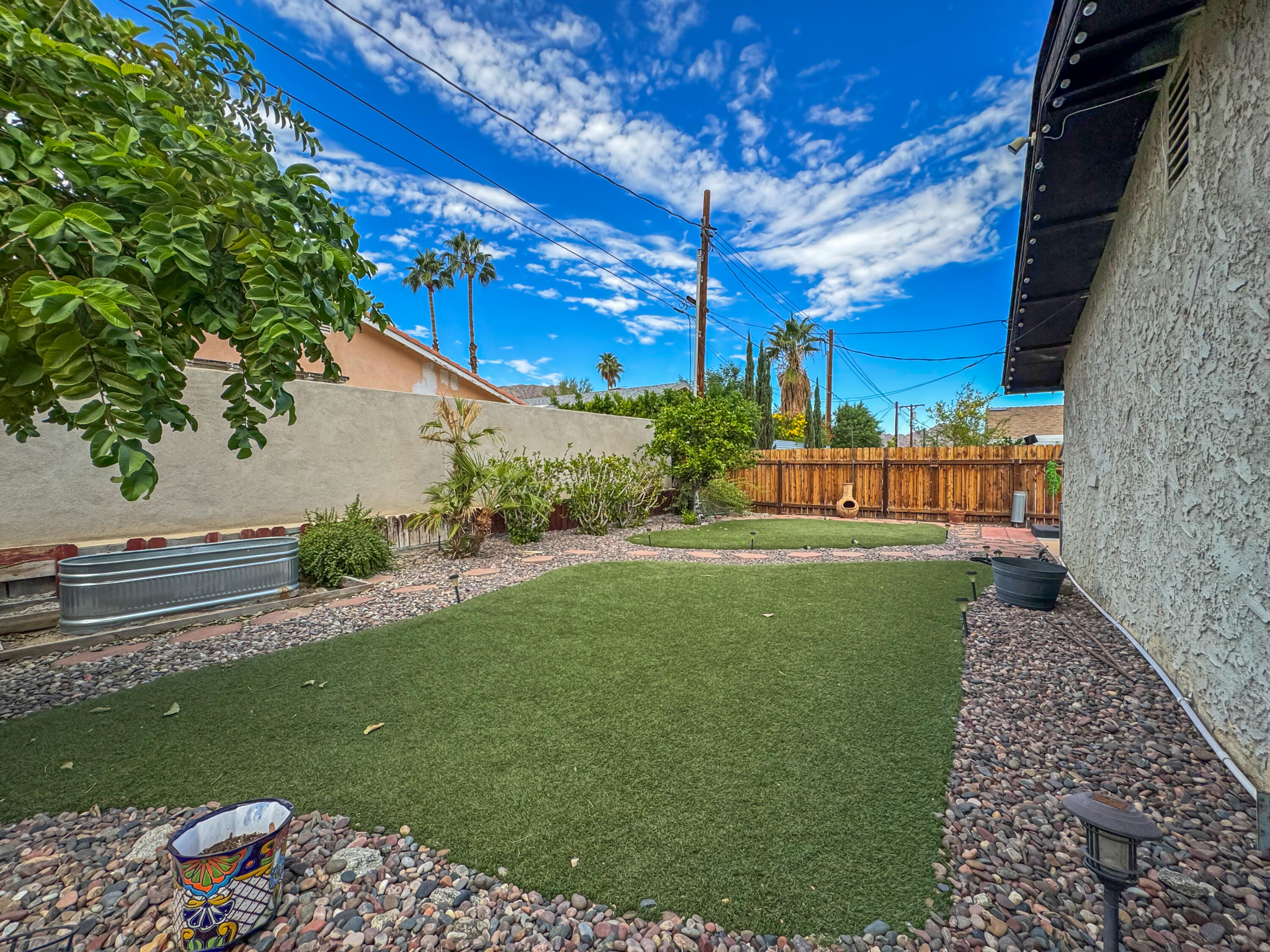 53845 Avenida Herrera La Quinta, CA 92253 - Photo 24 of 25 a view of a garden with a bench