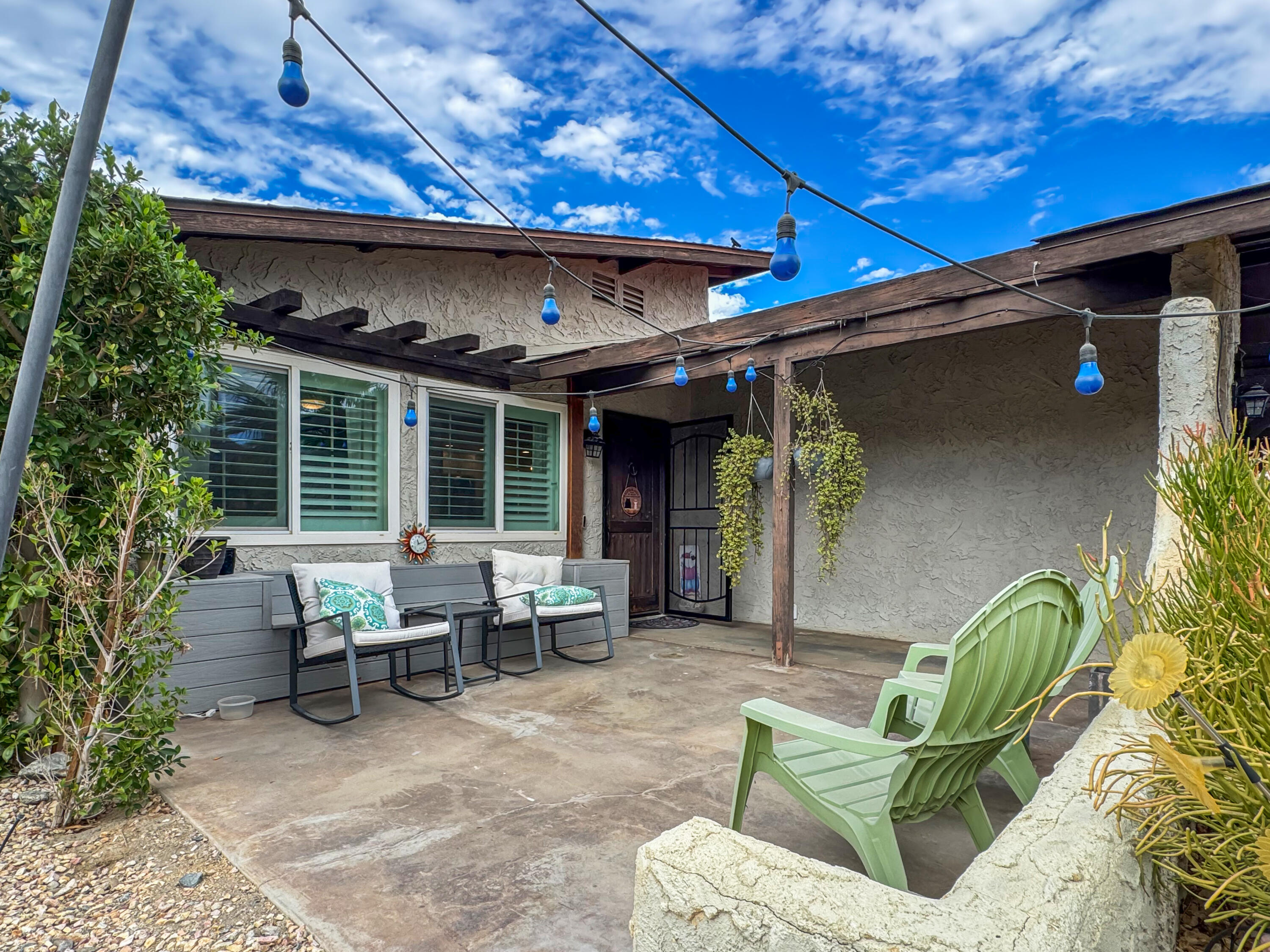 53845 Avenida Herrera La Quinta, CA 92253 - Photo 4 of 25 a view of a patio with table and chairs potted plants and a table