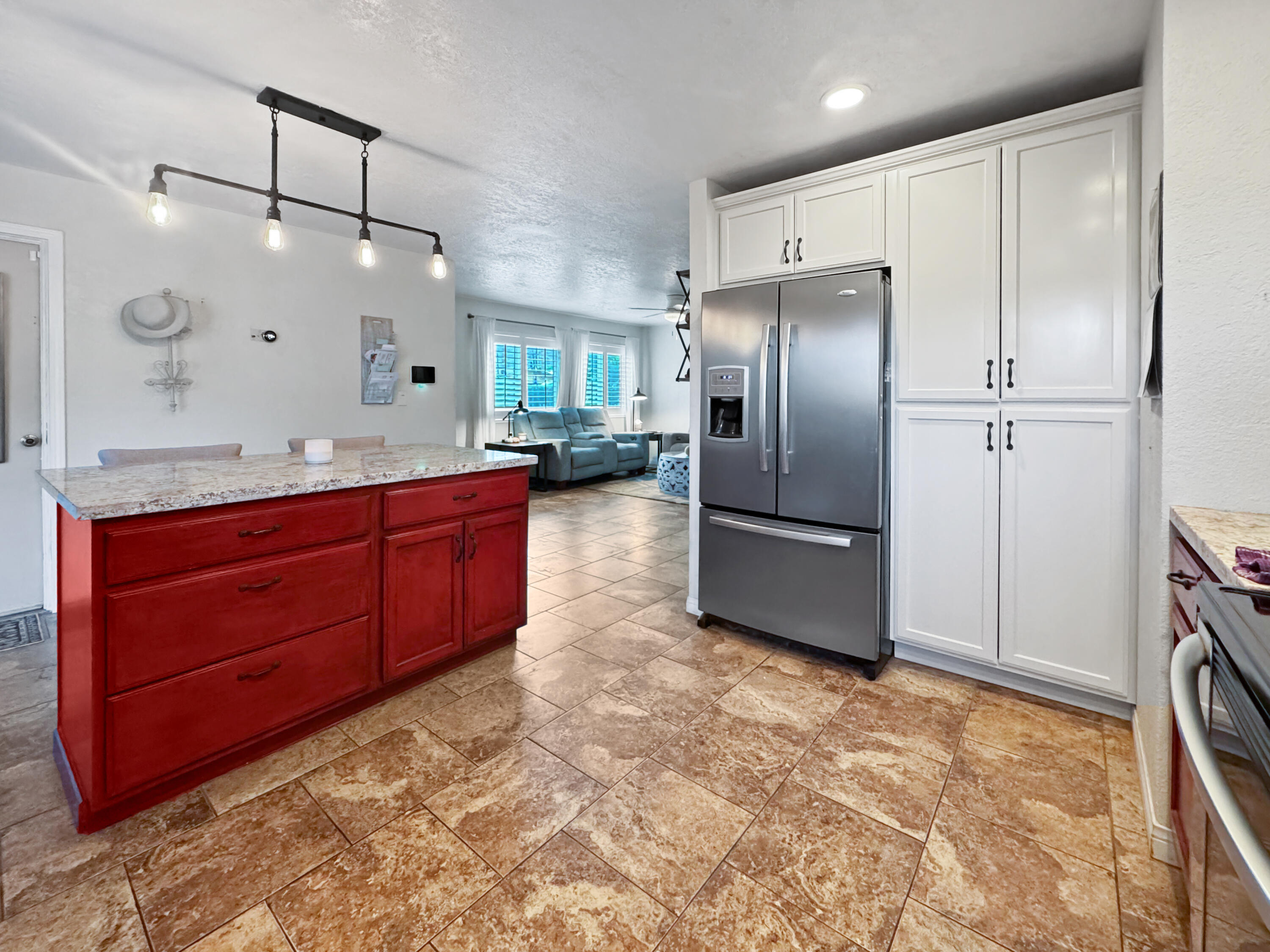 53845 Avenida Herrera La Quinta, CA 92253 - Photo 10 of 25 a kitchen with granite countertop a refrigerator and a sink