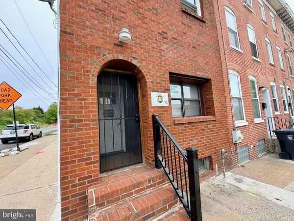a view of a brick house with many windows