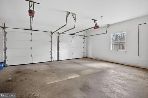 a view of a patio with chair and tables