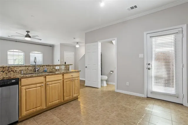a view of kitchen and hall with wooden floor