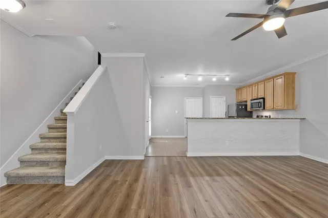 a view of a kitchen with a stove cabinets and wooden floor