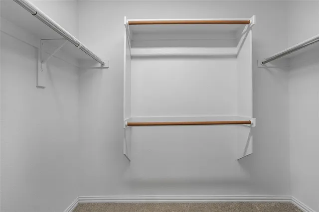 a bathroom with a shower and a glass door