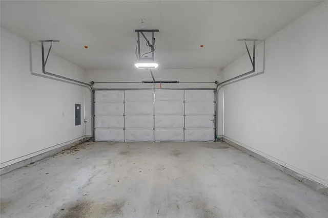 a view of a brick house with wooden fence