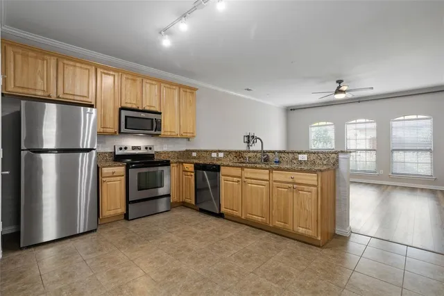 a large bathroom with a large mirror vanity and a sink