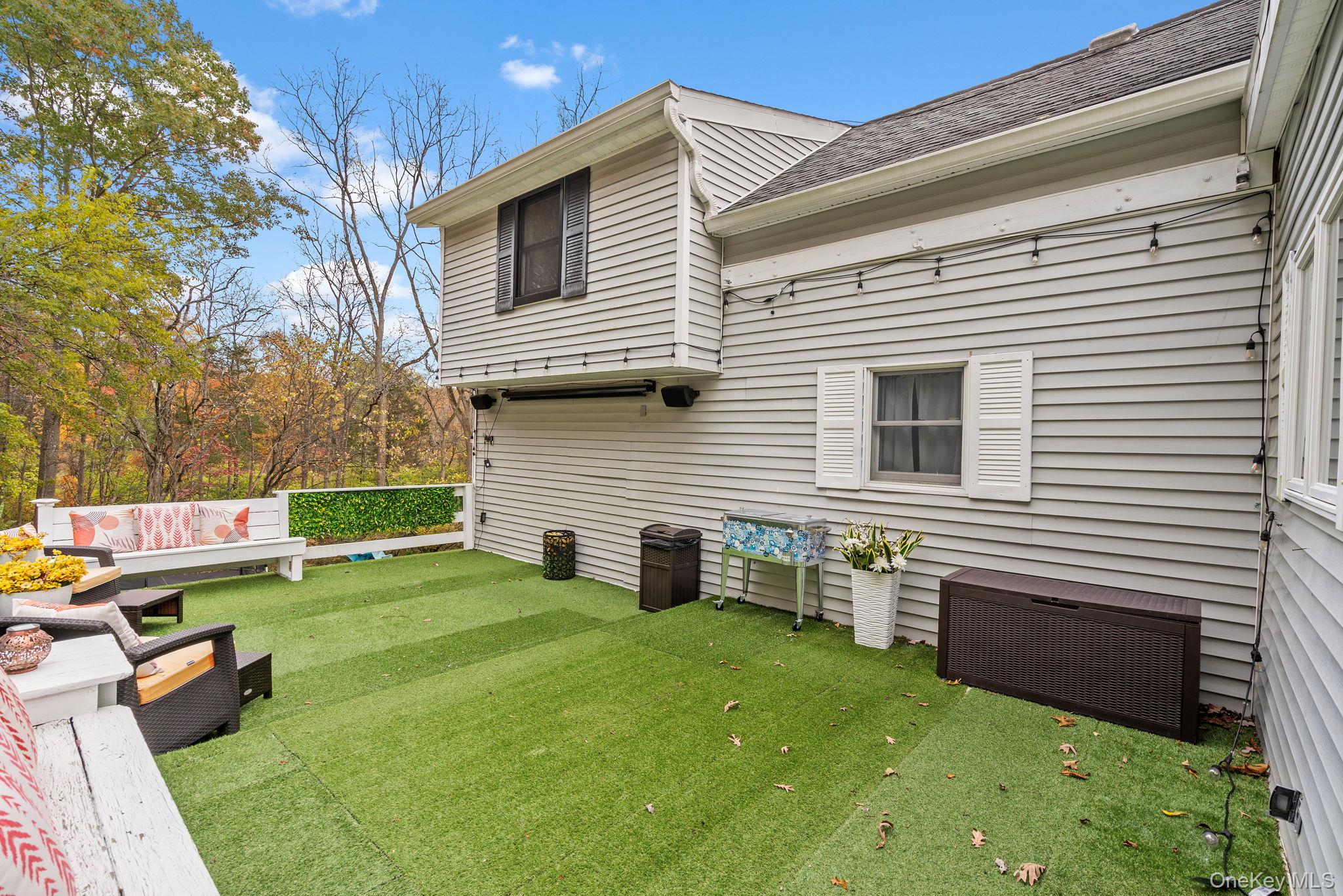 168 Fostertown Road Newburgh, NY 12550 - Photo 37 of 38 Rear view of property featuring a shingled roof and a lawn