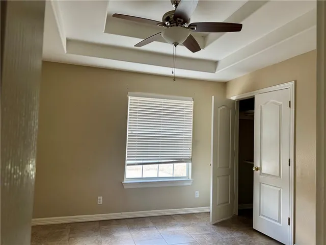 a view of storage and utility room with refrigerator and washer