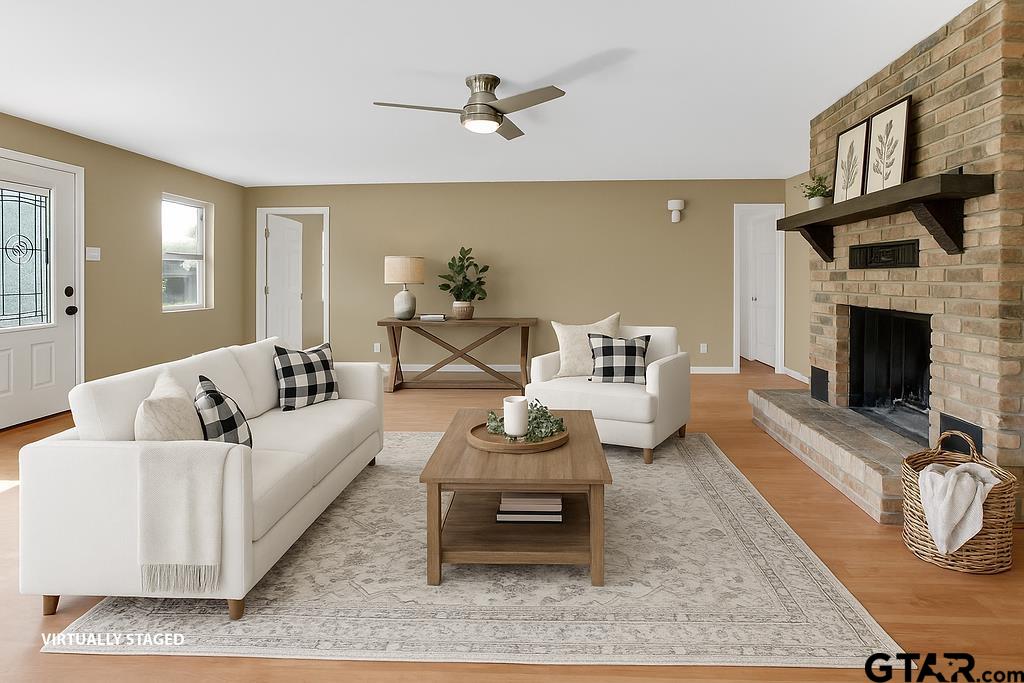 213 Treetop Lane Hideaway, TX 75771 - Photo 14 of 48 a living room with furniture and a fireplace