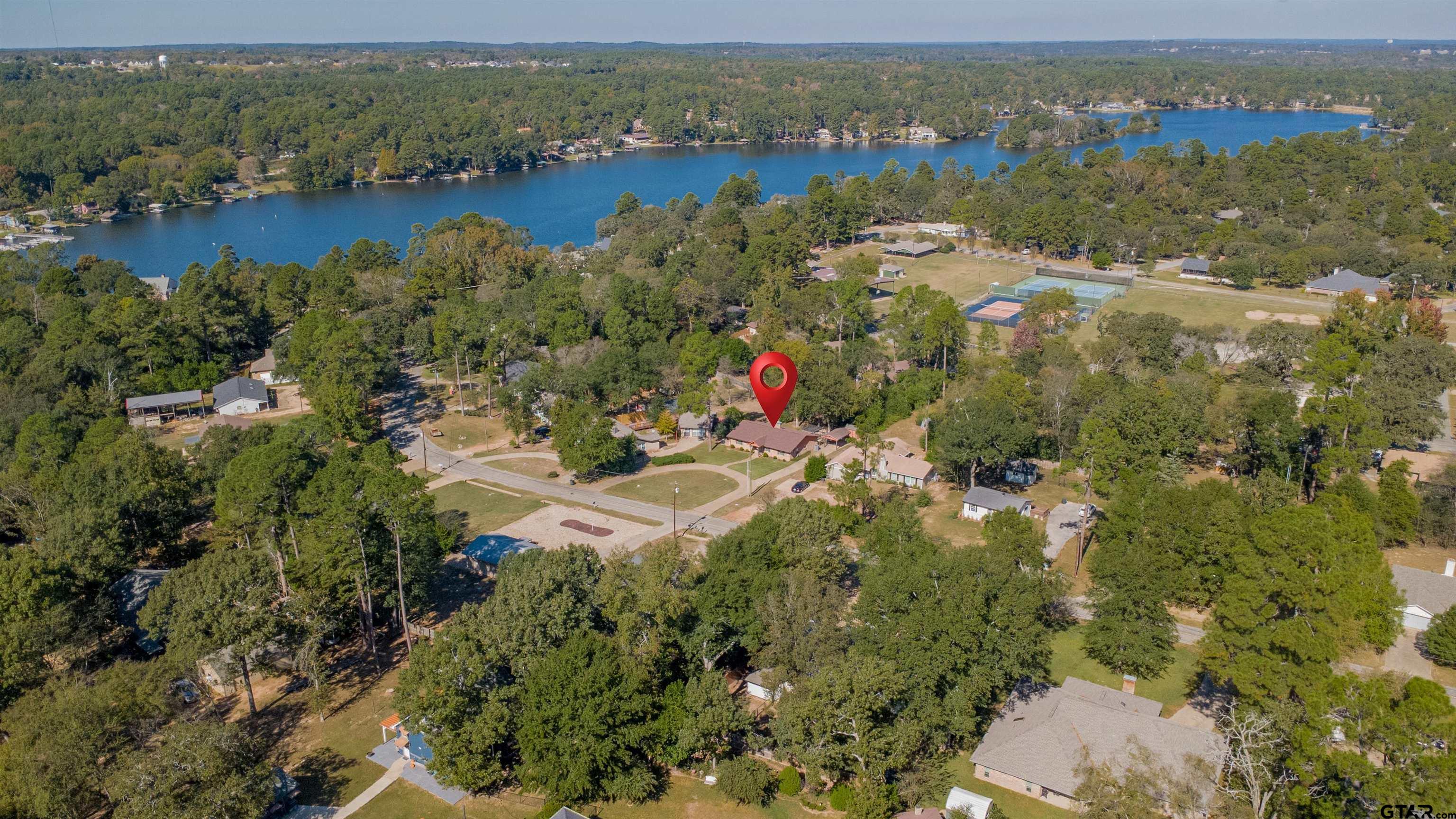 213 Treetop Lane Hideaway, TX 75771 - Photo 2 of 48 aerial view of a houses with a lake view