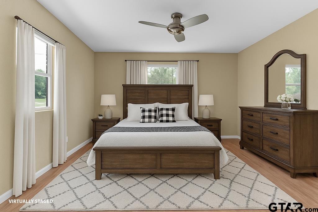 213 Treetop Lane Hideaway, TX 75771 - Photo 23 of 48 a bedroom with a bed and a dresser