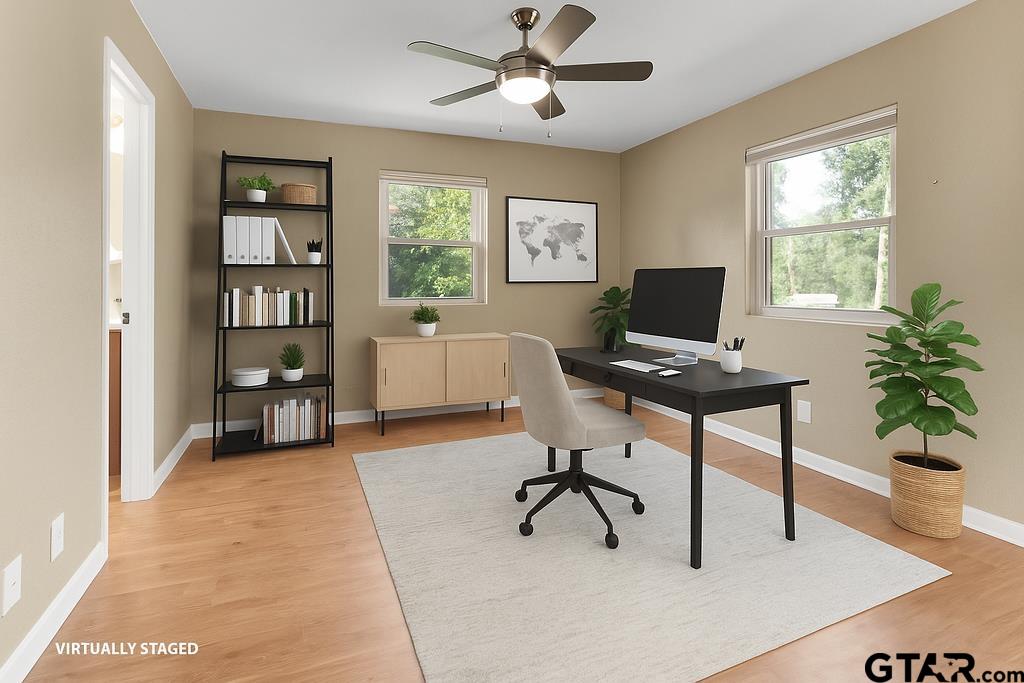 213 Treetop Lane Hideaway, TX 75771 - Photo 29 of 48 a workspace with wooden floor and a window