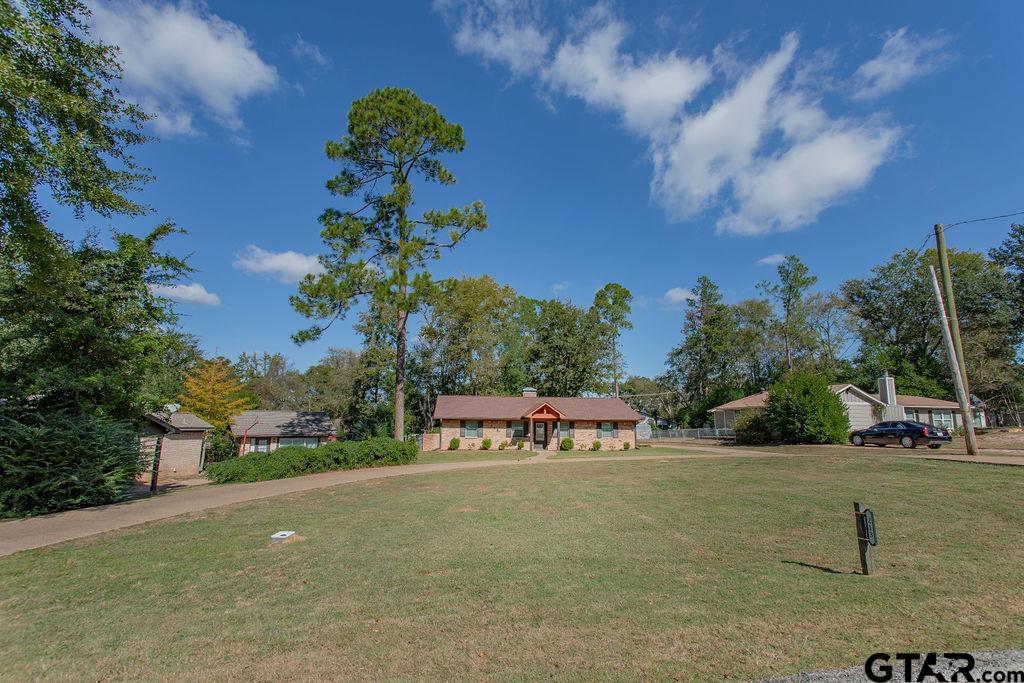 213 Treetop Lane Hideaway, TX 75771 - Photo 3 of 48 a view of a street with houses