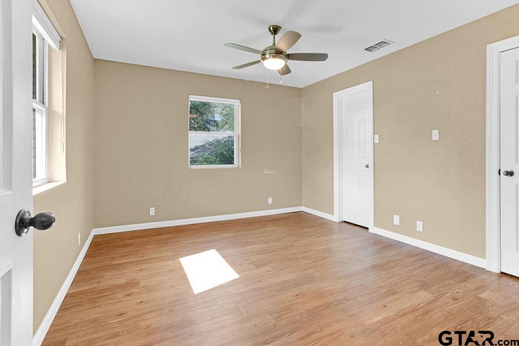 213 Treetop Lane Hideaway, TX 75771 - Photo 34 of 48 wooden floor in an empty room with a window