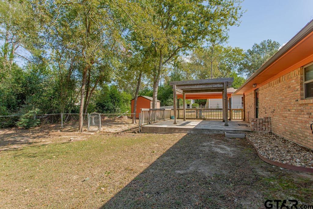213 Treetop Lane Hideaway, TX 75771 - Photo 38 of 48 a view of a house with backyard and sitting area