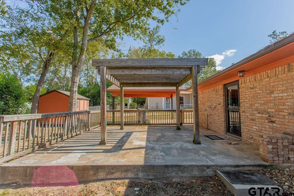 213 Treetop Lane Hideaway, TX 75771 - Photo 39 of 48 a view of a chairs and table in the patio