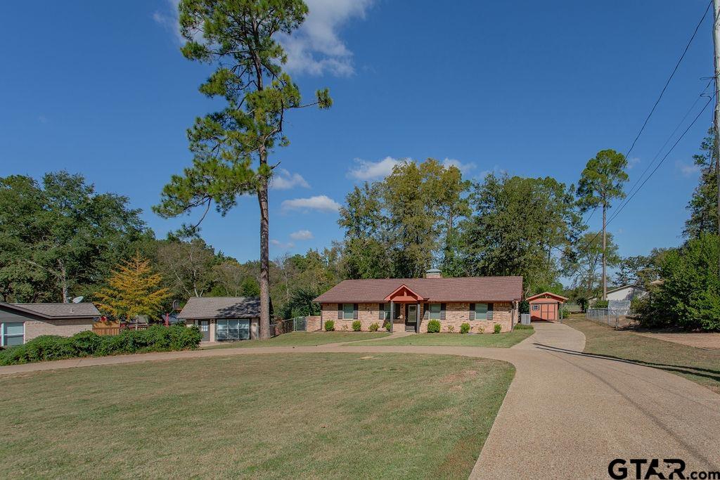 213 Treetop Lane Hideaway, TX 75771 - Photo 4 of 48 an outdoor space with swimming pool and trees