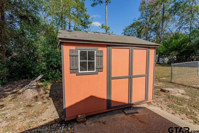 a backyard of a house with two tub and outdoor space
