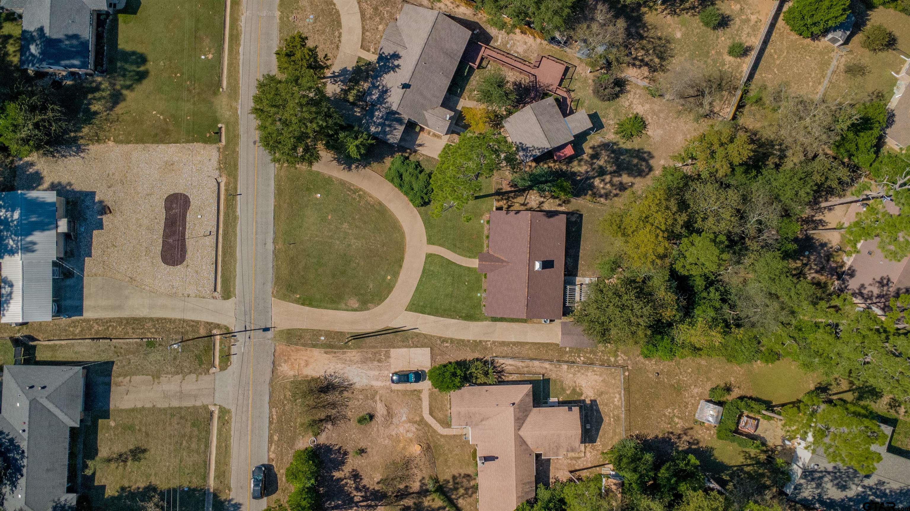 213 Treetop Lane Hideaway, TX 75771 - Photo 6 of 48 an aerial view of a house with a yard and swimming pool