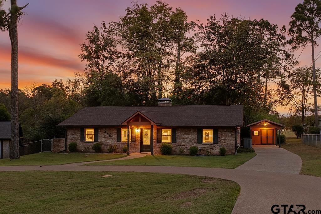 213 Treetop Lane Hideaway, TX 75771 - Photo 7 of 48 a front view of a house with a yard