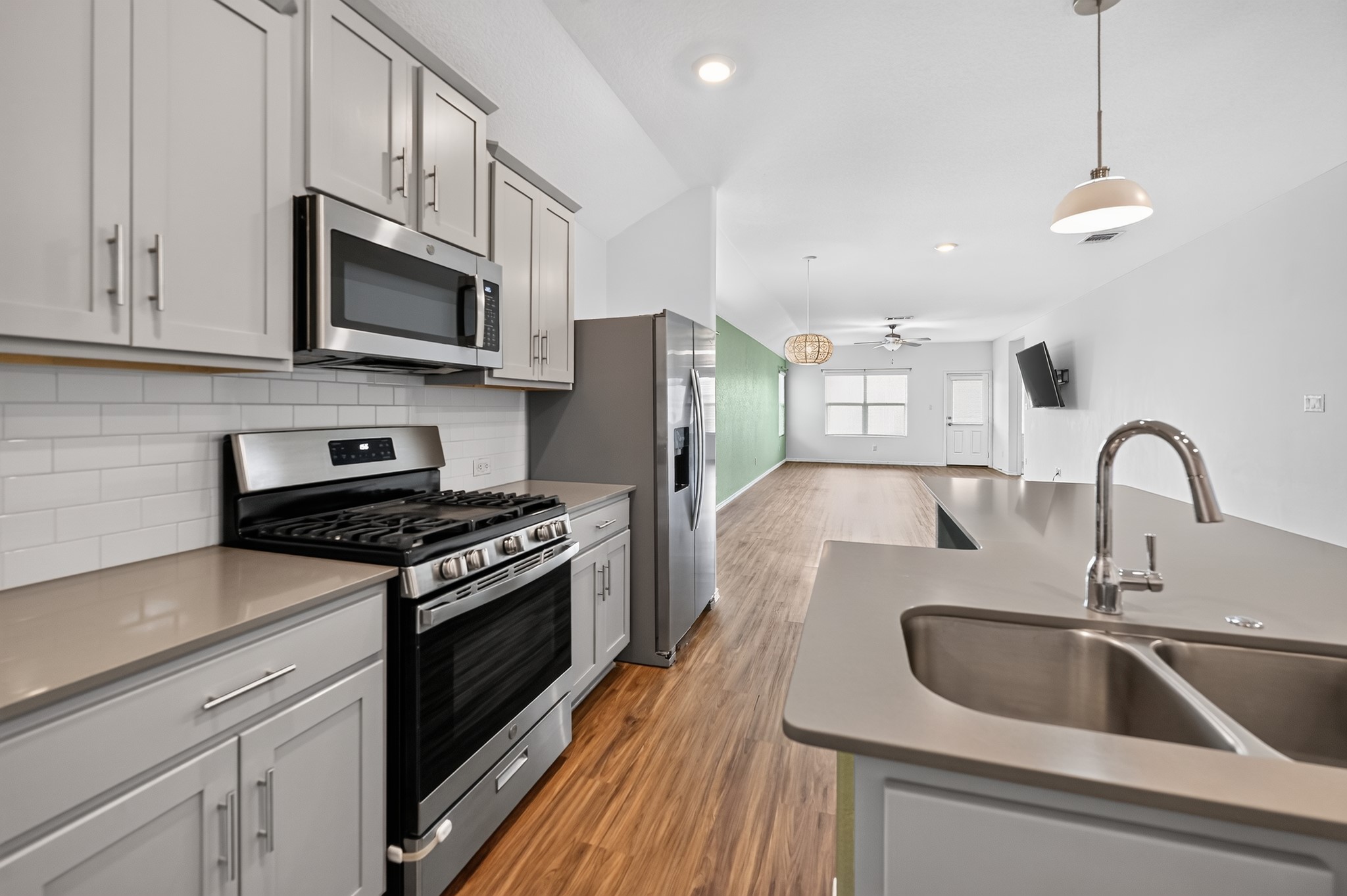 128 Konik Road Georgetown, TX 78626 - Photo 9 of 34 Culinary delights await in this modern kitchen with sleek appliances and an open-concept layout.