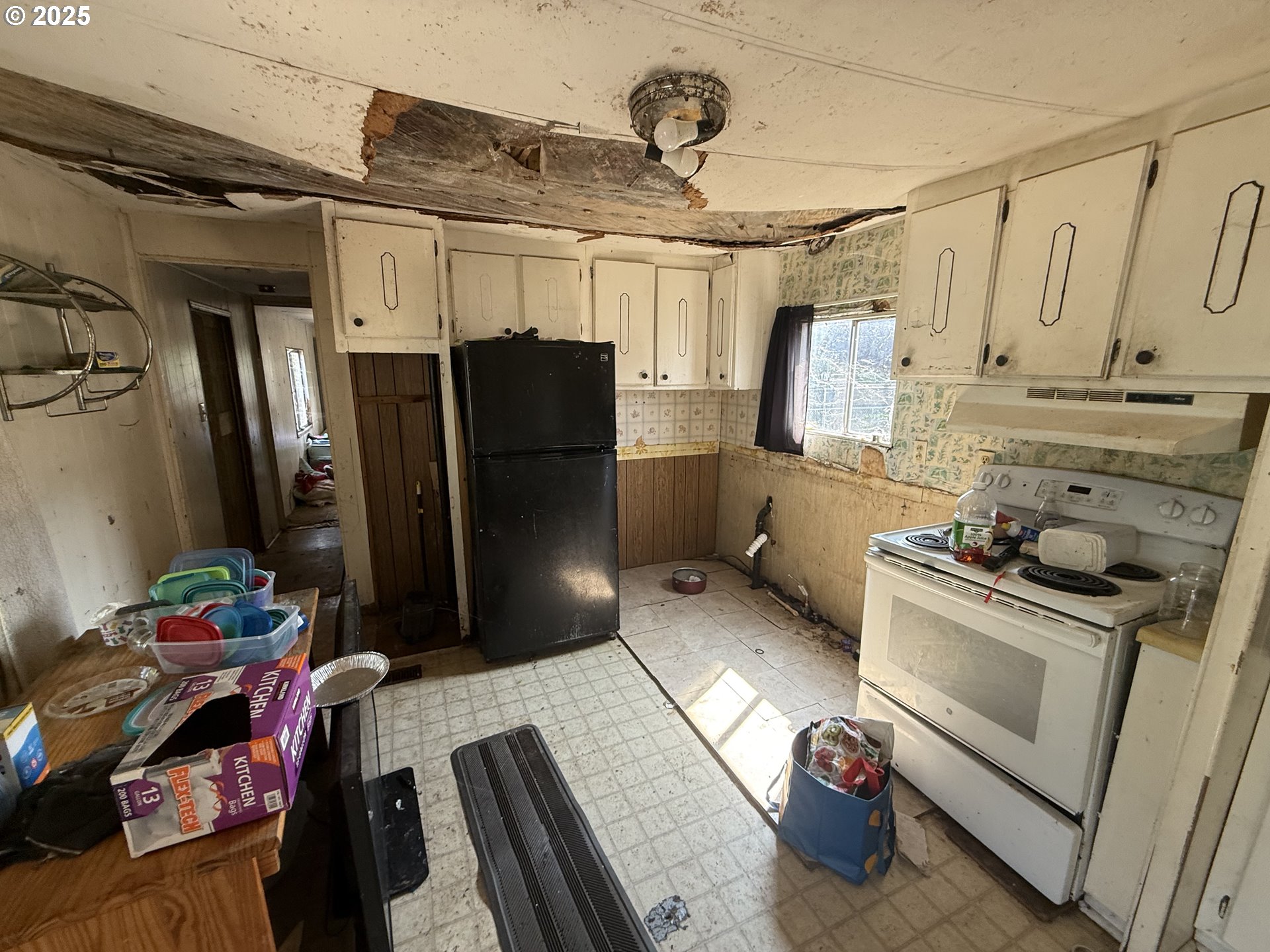 410 Birch Street Drain, OR 97435 - Photo 13 of 14 a kitchen with stainless steel appliances granite countertop a refrigerator and a stove