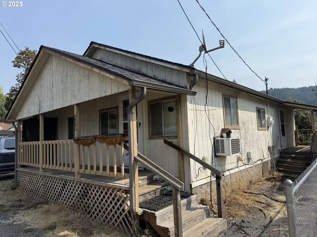 a view of a house with wooden floor and wooden fence