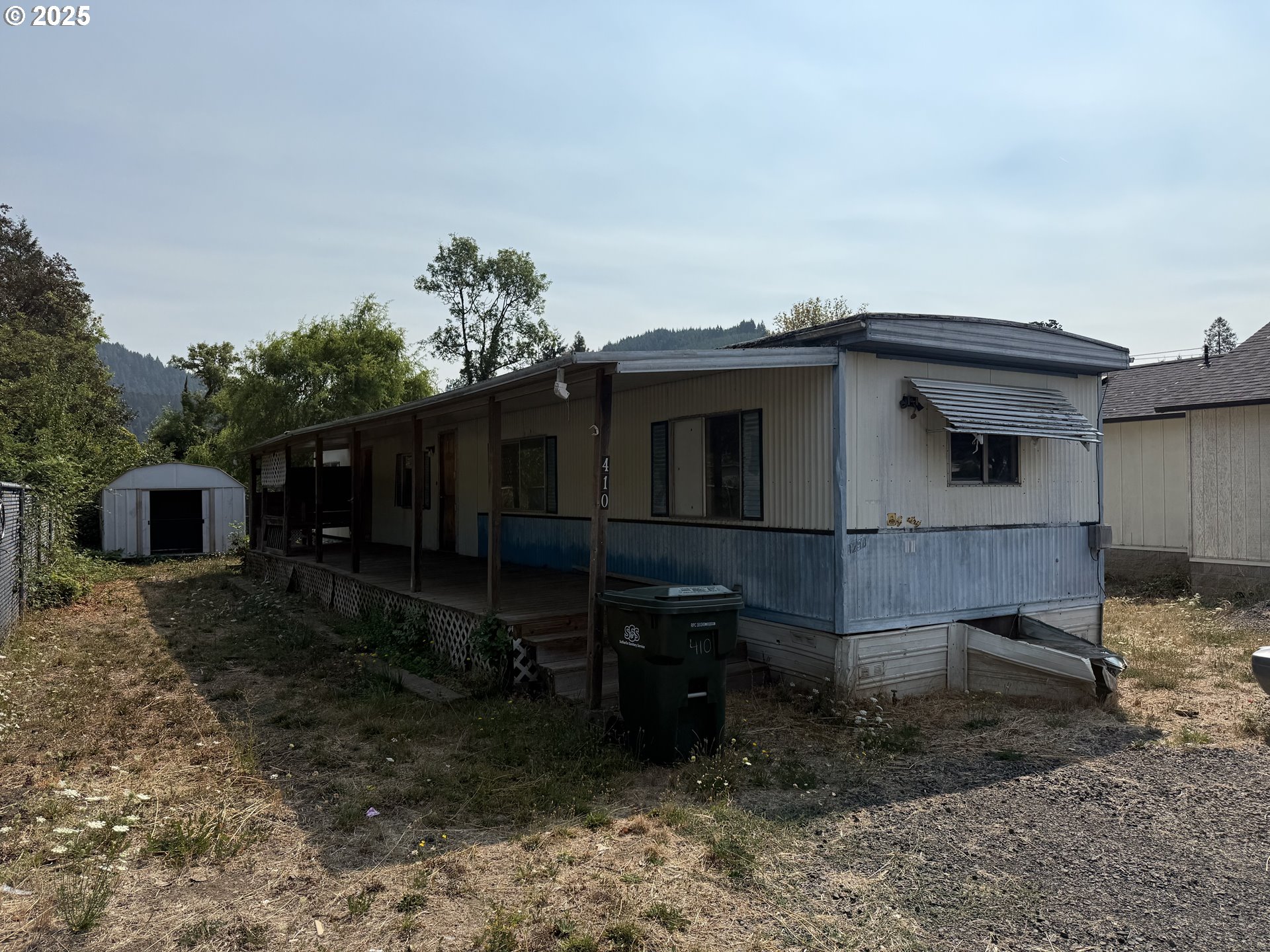 410 Birch Street Drain, OR 97435 - Photo 3 of 14 a backyard of a house with lots of green space