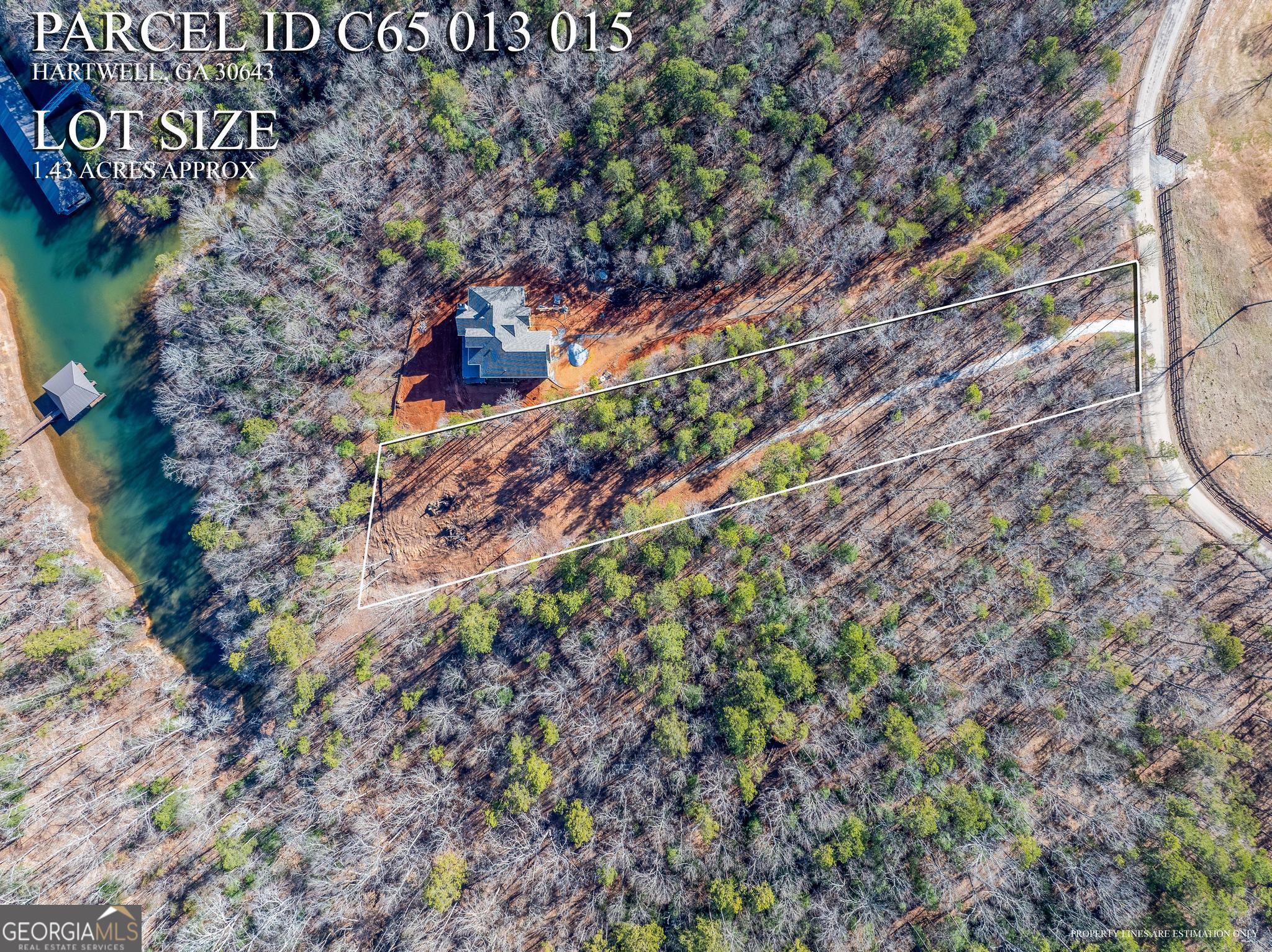 395 Tom Cobb Drive Hartwell, GA 30643 - Photo 6 of 24 a backyard of a building with large trees