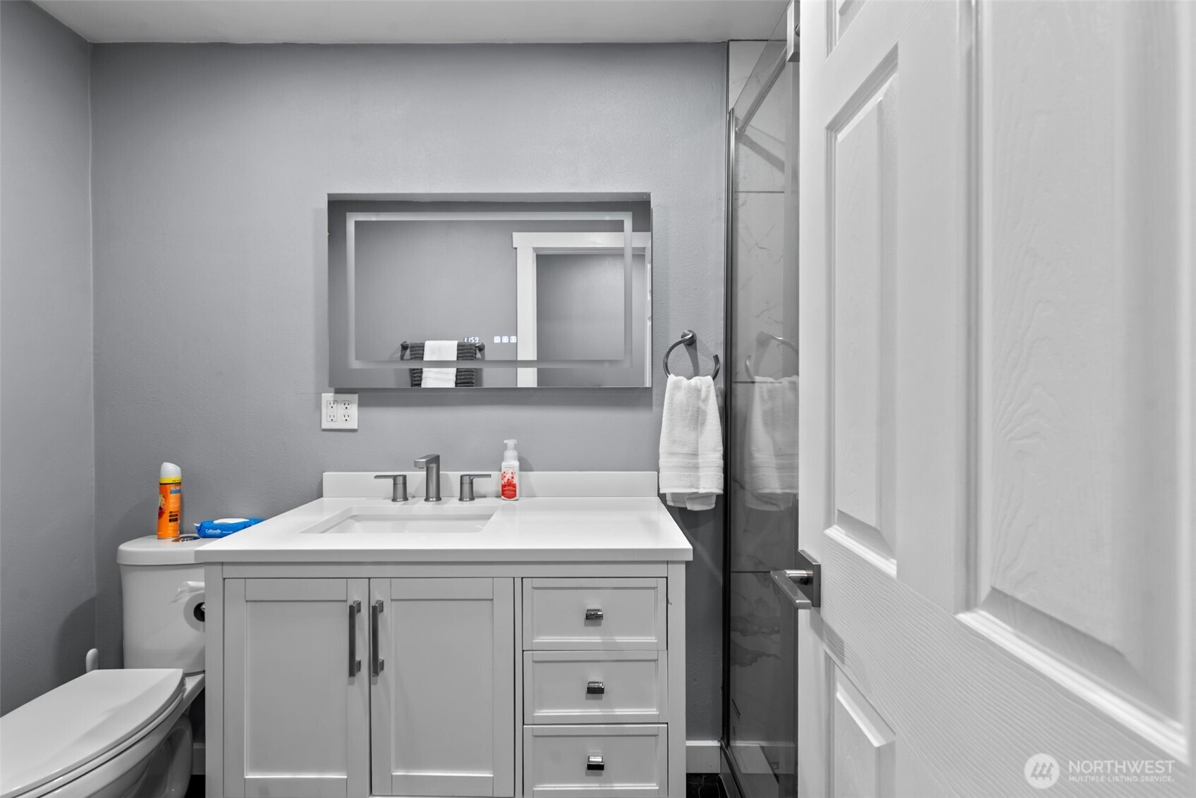 1750 Methow Street Wenatchee, WA 98801 - Photo 11 of 33 a bathroom with a sink vanity mirror and toilet