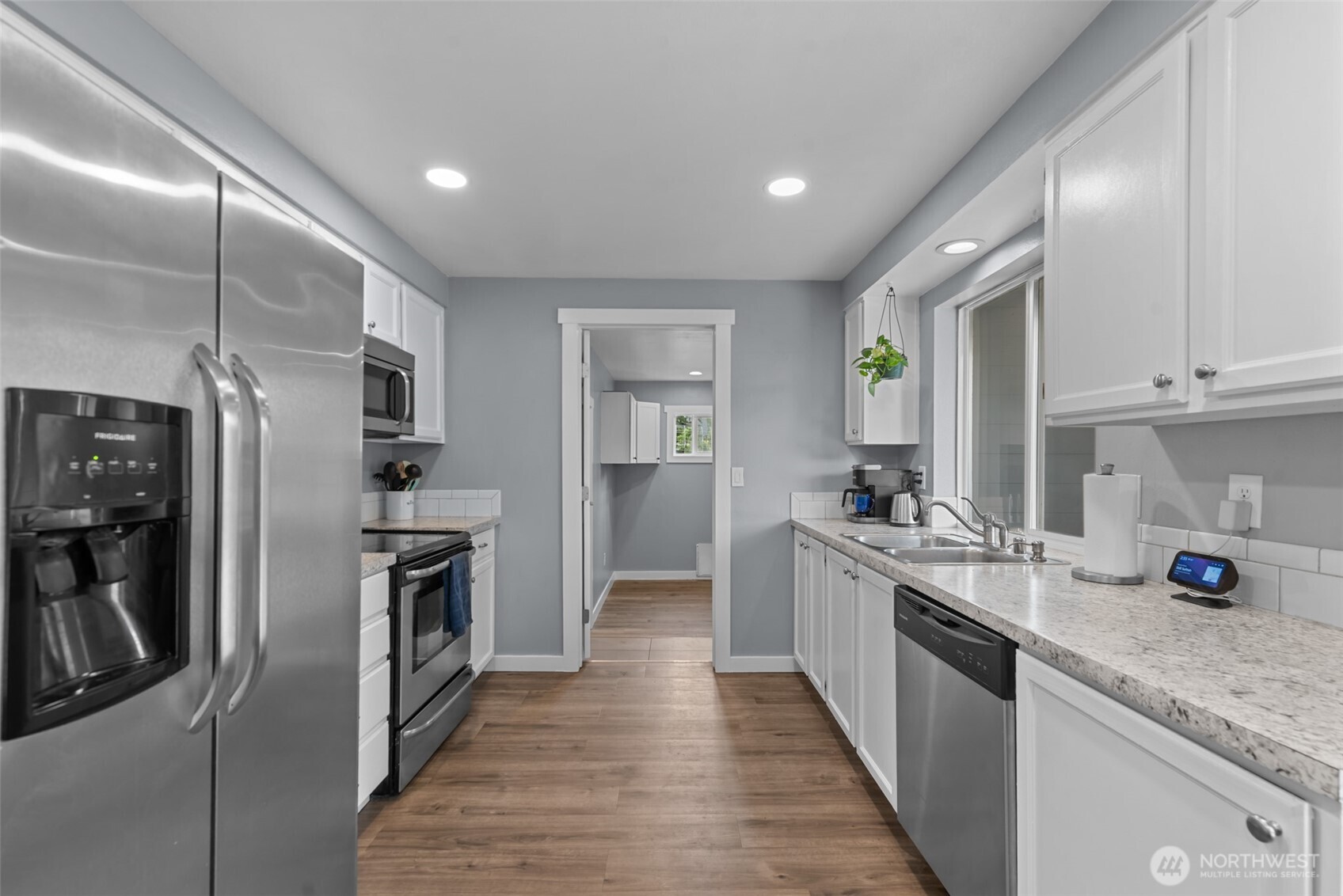 1750 Methow Street Wenatchee, WA 98801 - Photo 19 of 33 a kitchen with stainless steel appliances granite countertop a refrigerator a stove and a sink