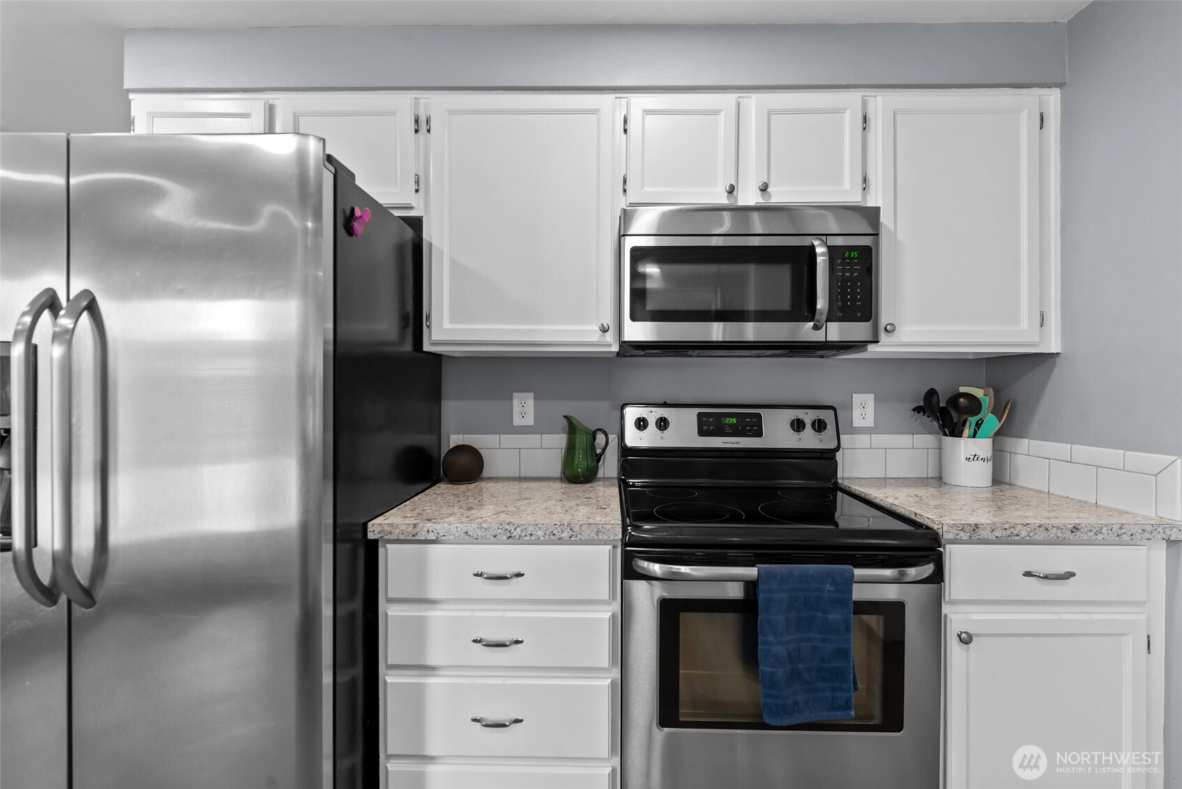 1750 Methow Street Wenatchee, WA 98801 - Photo 20 of 33 a kitchen with cabinets stainless steel appliances and a counter space