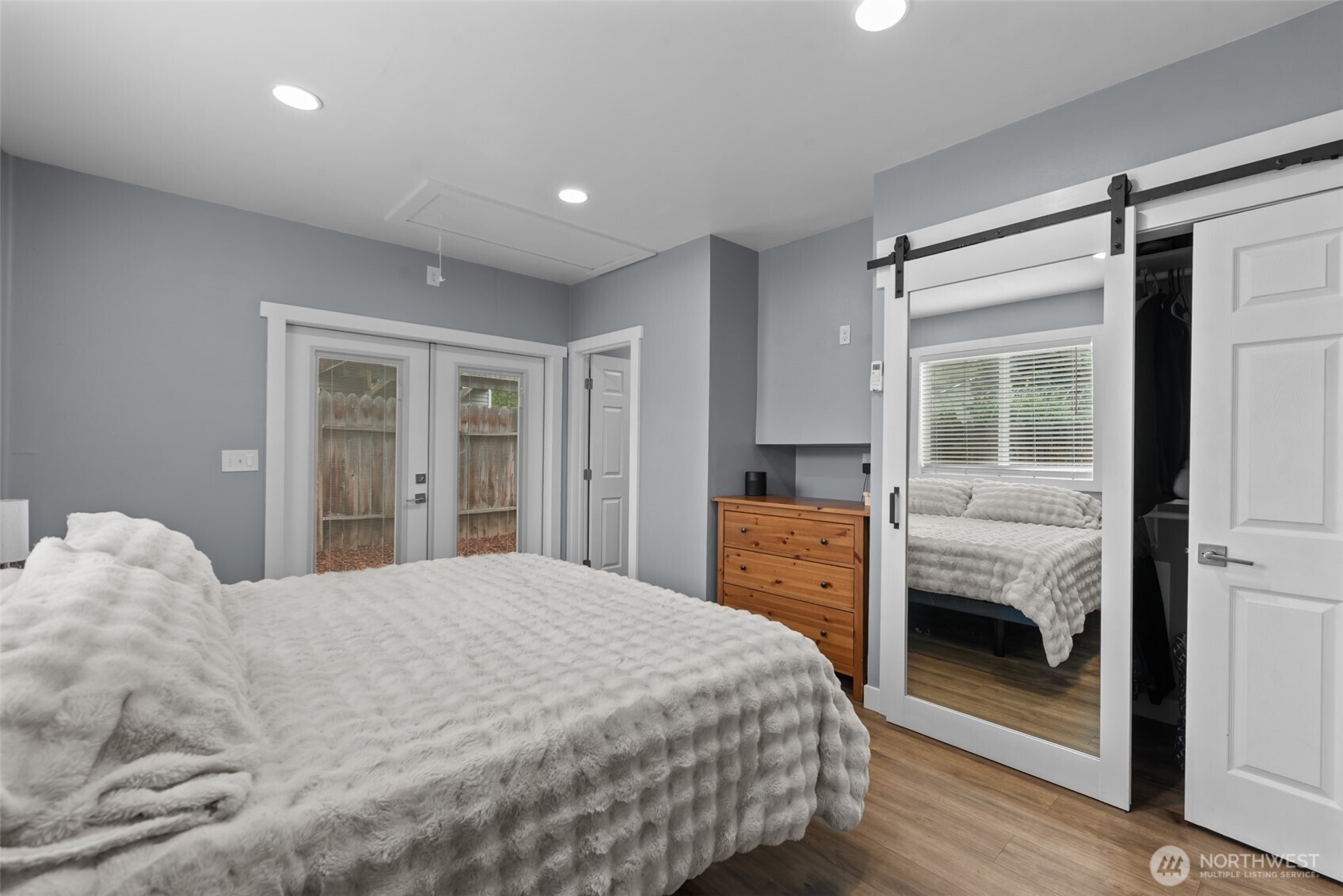 1750 Methow Street Wenatchee, WA 98801 - Photo 25 of 33 a bedroom with a large bed and wooden floor