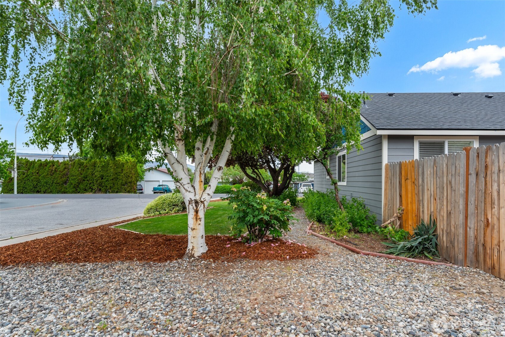 1750 Methow Street Wenatchee, WA 98801 - Photo 32 of 33 a front view of a house with a yard and tree