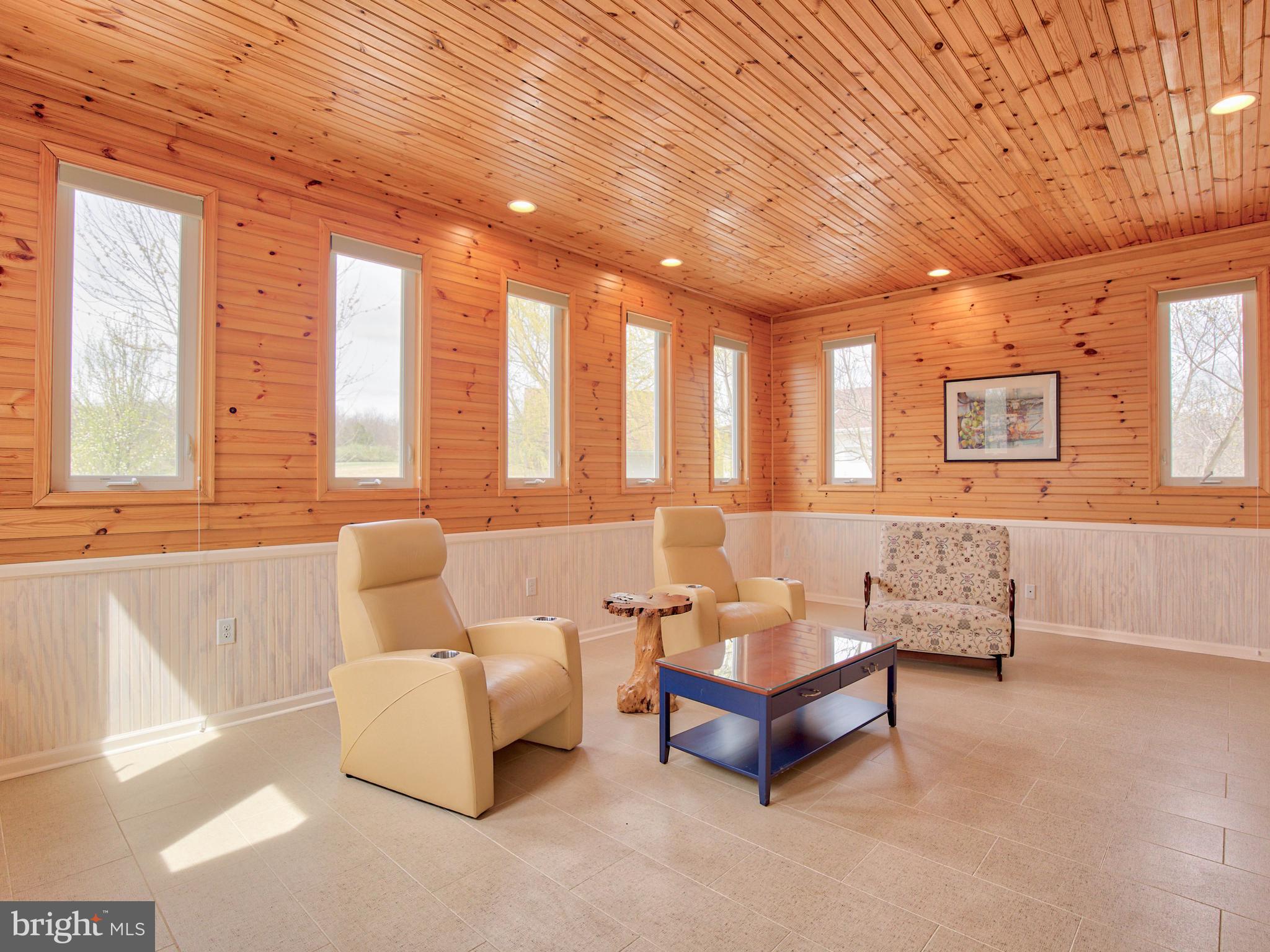 6485 Summit Point Road Charles Town, WV 25414 - Photo 21 of 71 notty wood panneling in TV room