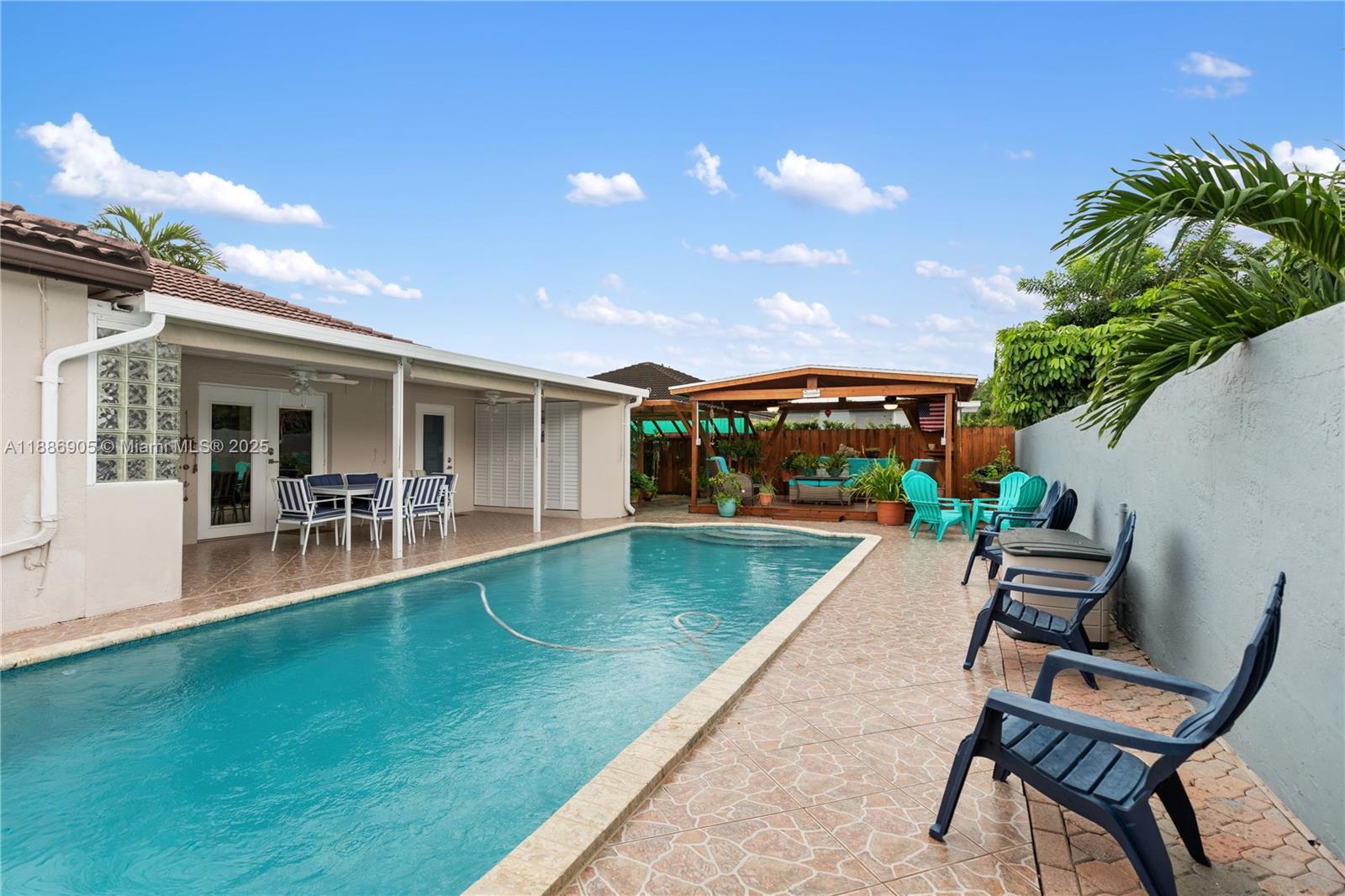 a view of a house with a backyard