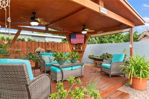 a room with furniture pool table and a fireplace