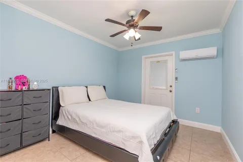 a bedroom with a bed and a closet