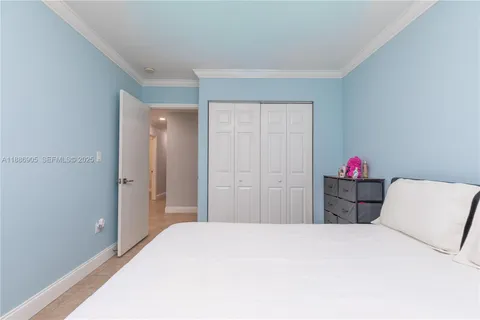 a kitchen with refrigerator and cabinets