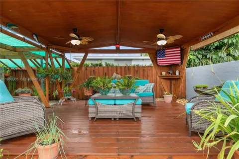 a view of a chairs and table in a patio