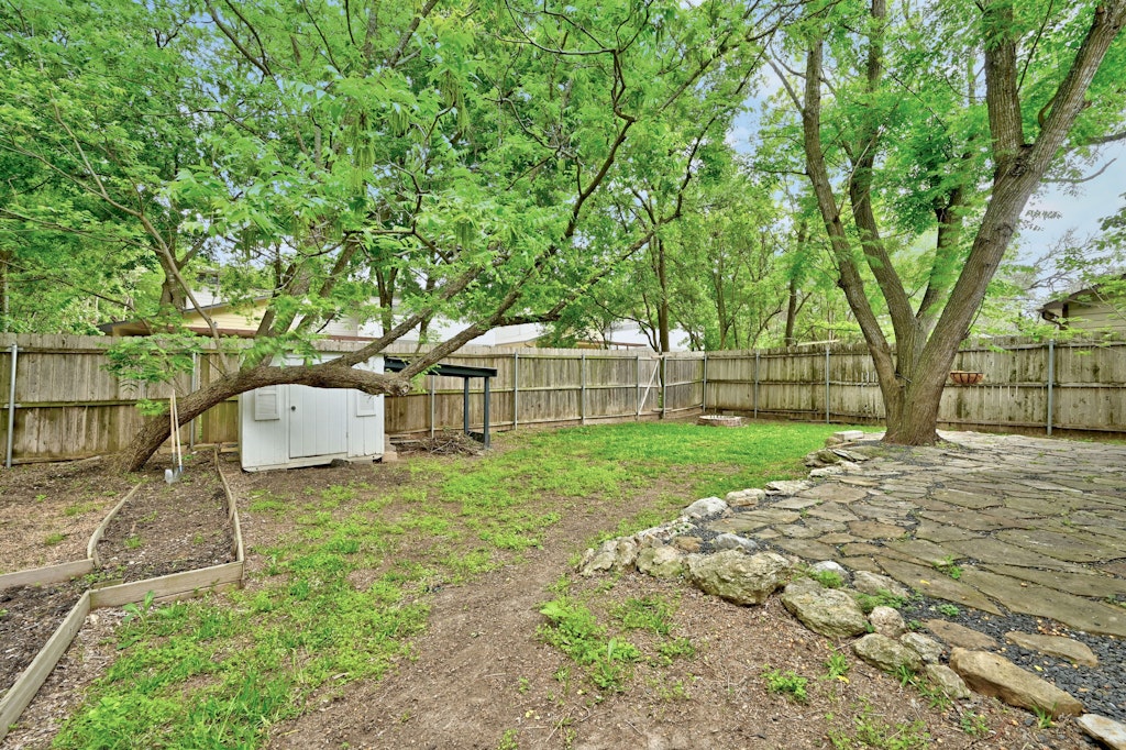 4025 Valley View Road, Unit 2 Austin, TX 78704 - Photo 18 of 19 a white house that has a tree in front of it