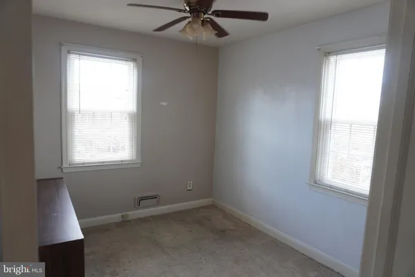 a bathroom with a sink toilet and mirror