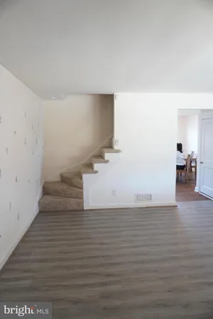 a view of a livingroom with wooden floor