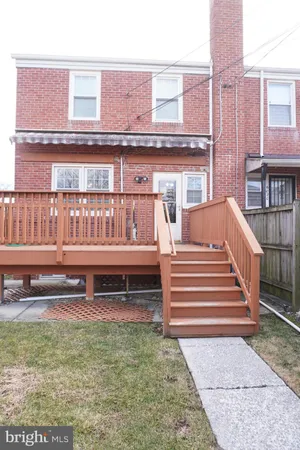a view of a brick building with a yard