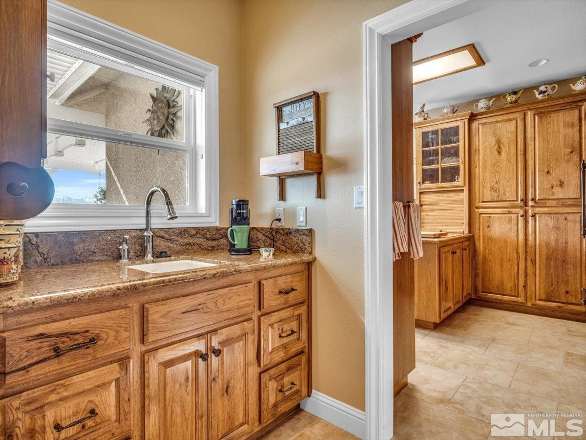 2034 Comstock Drive Gardnerville, NV 89410 - Photo 12 of 40 a bathroom with a sink and a mirror